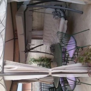 gazebo ottagonale in ferro con tende e zanzariere
